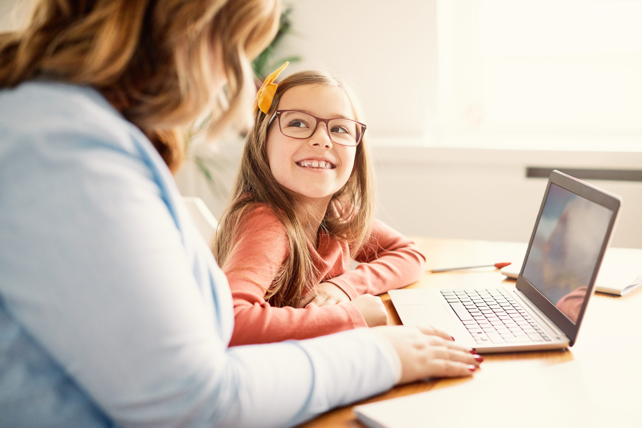 Mother and Daughter Learning Online.