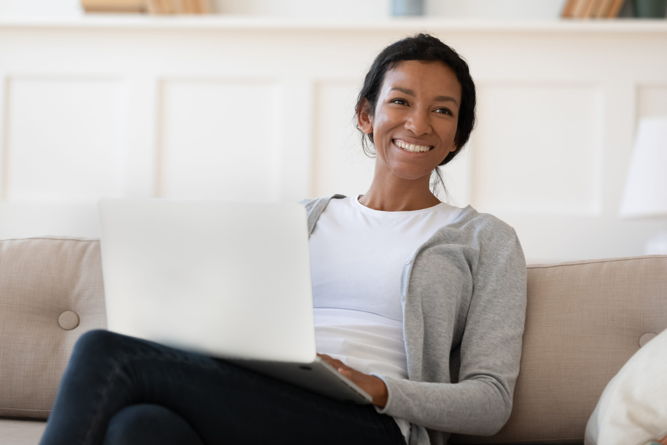 Woman Working At Home on Premier Broadband WIFI