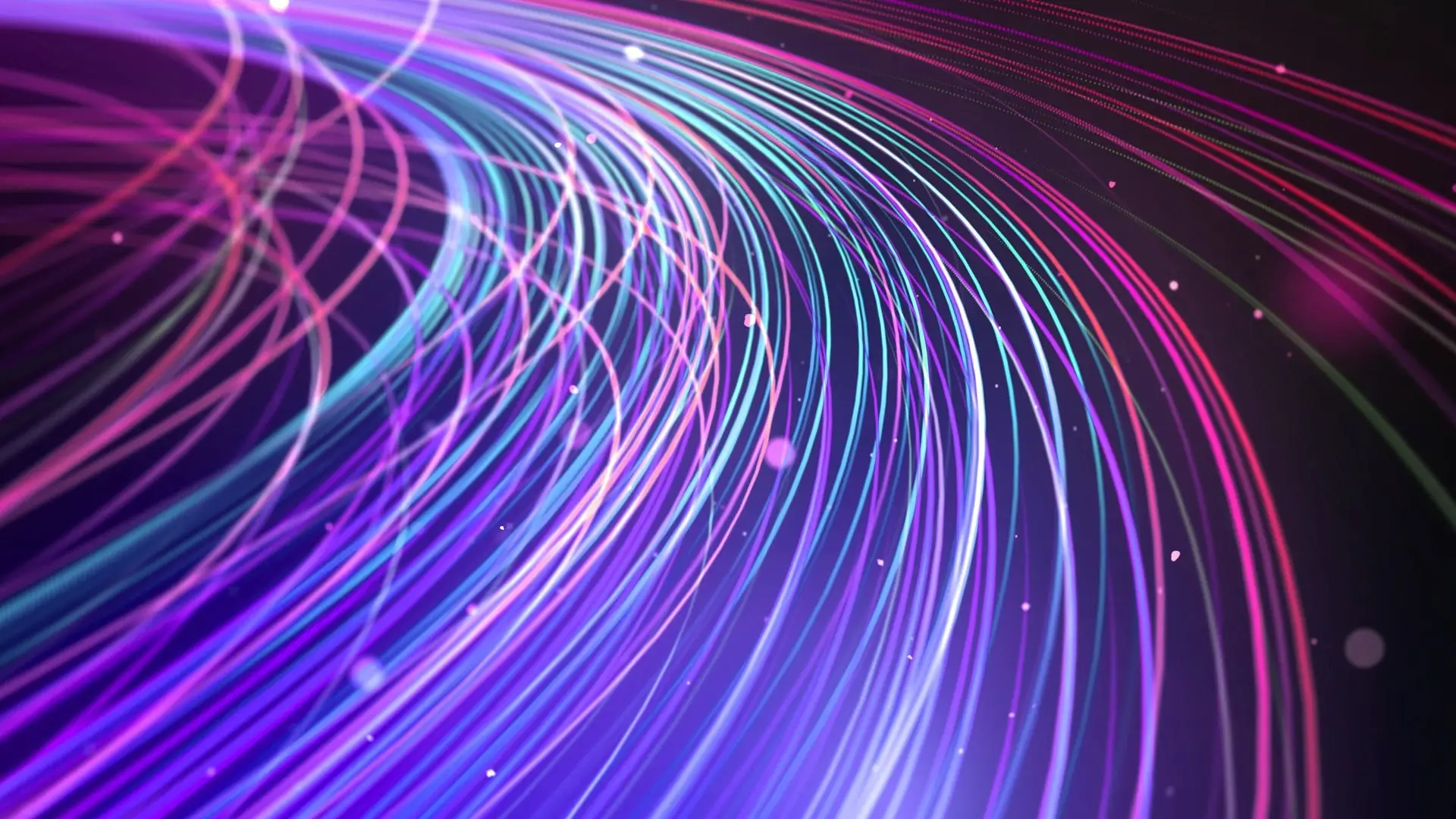 Colorful, curved lines in shades of purple, blue, and pink swirl across a dark background, evoking the high-speed flow of Fiber Internet. Small glowing particles are scattered throughout this abstract, futuristic light trail effect.