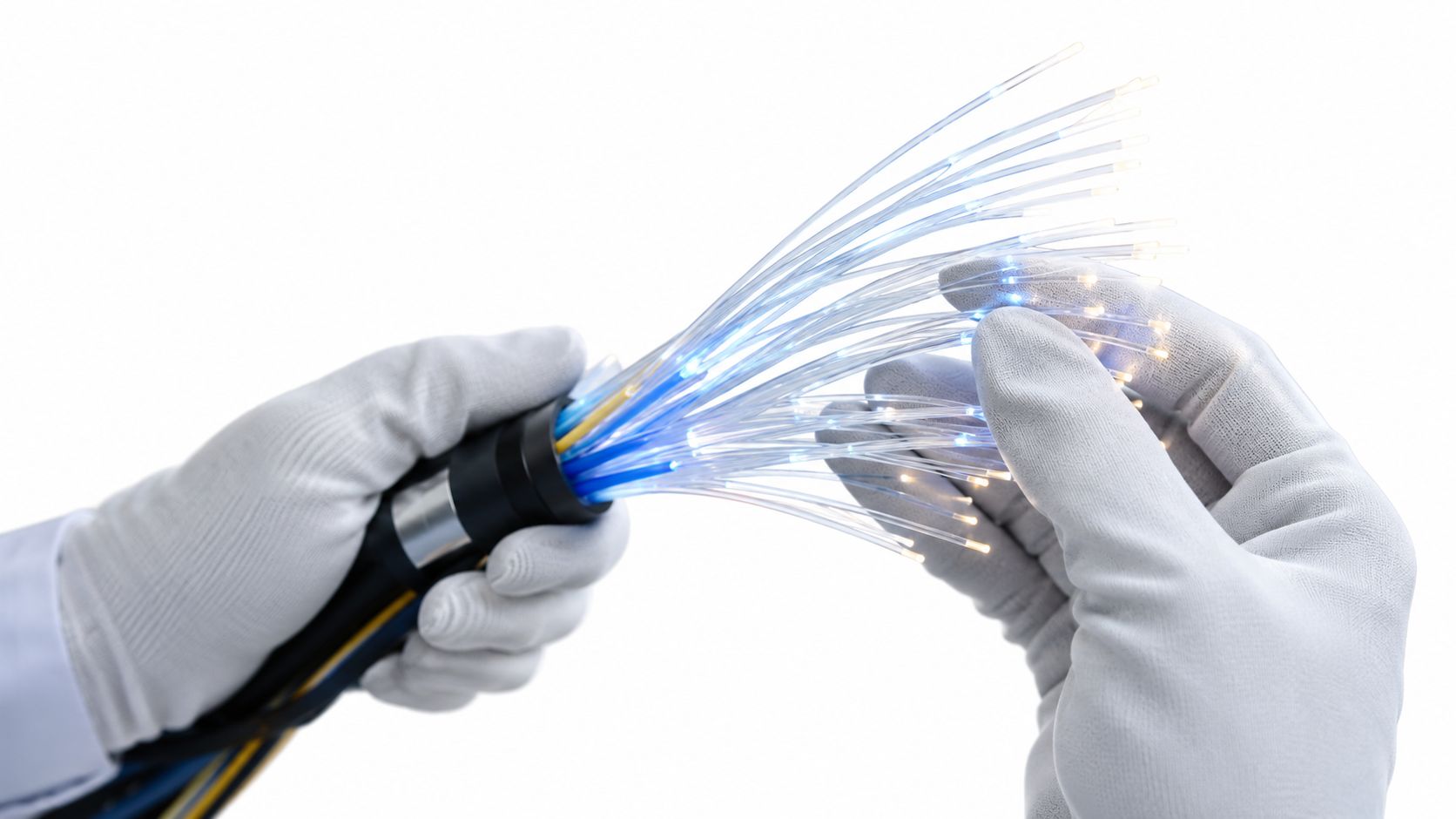 A technician wearing white gloves holds and inspects a bundle of glowing fiber optic internet cables.